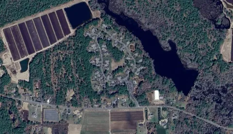 a view of a swimming pool with a yard