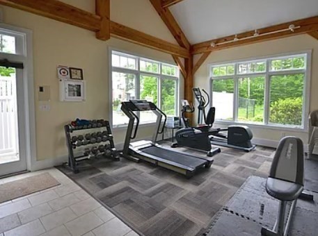 57 Hathaway Pond Circle, Unit 57 Rochester, MA 02770 - Photo 33 of 40 a room with gym equipment and large window