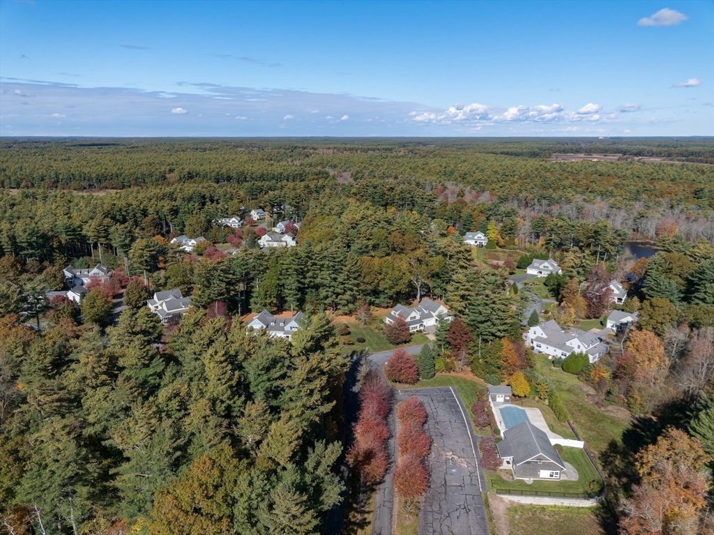57 Hathaway Pond Circle, Unit 57 Rochester, MA 02770 - Photo 37 of 40 an aerial view of residential houses with outdoor space and trees