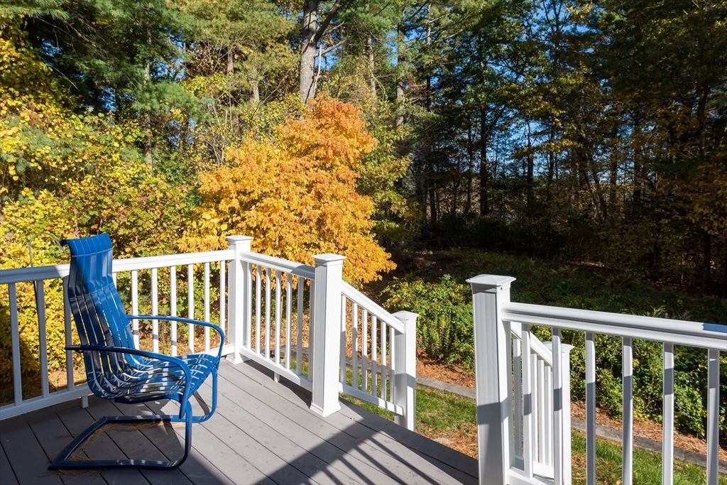 57 Hathaway Pond Circle, Unit 57 Rochester, MA 02770 - Photo 6 of 40 a view of a chair and table in the balcony