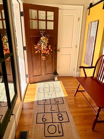 a view of a living room with furniture and a rug
