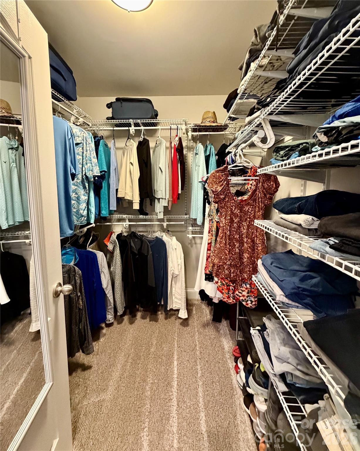 1220 Pecan Ridge Road Fort Mill, SC 29715 - Photo 14 of 25 a view of walk in closet with clothes and shoes