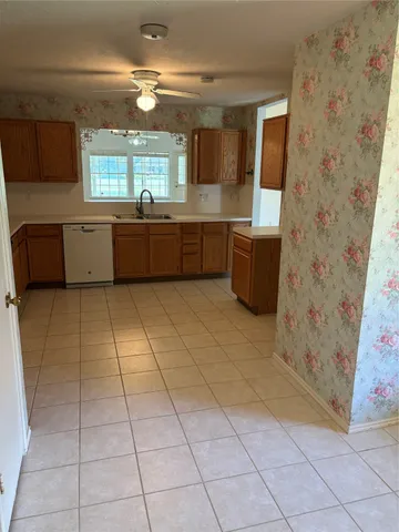 a view of a kitchen with microwave and cabinets