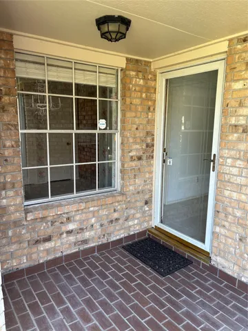 a view of a door and a window