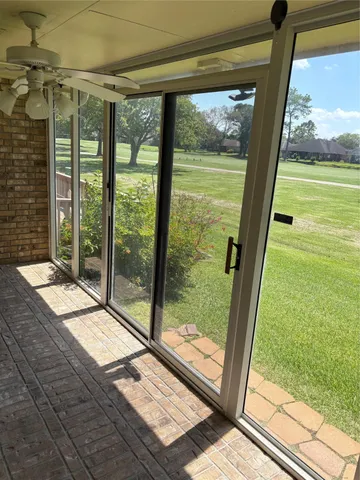 a view of backyard with large windows