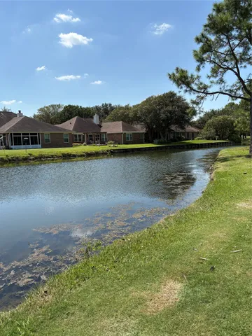 an aerial view of a houses with lake view