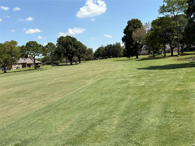 a view of a field with entertaining space