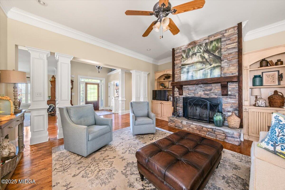 1060 East Magnolia Loop Madison, GA 30650 - Photo 11 of 41 a living room with furniture and a fireplace