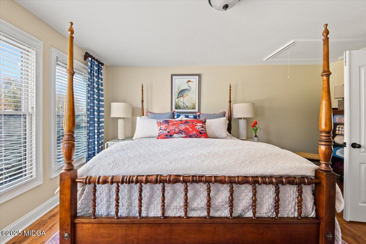 1060 East Magnolia Loop Madison, GA 30650 - Photo 25 of 41 a bedroom with a bed and a table in it