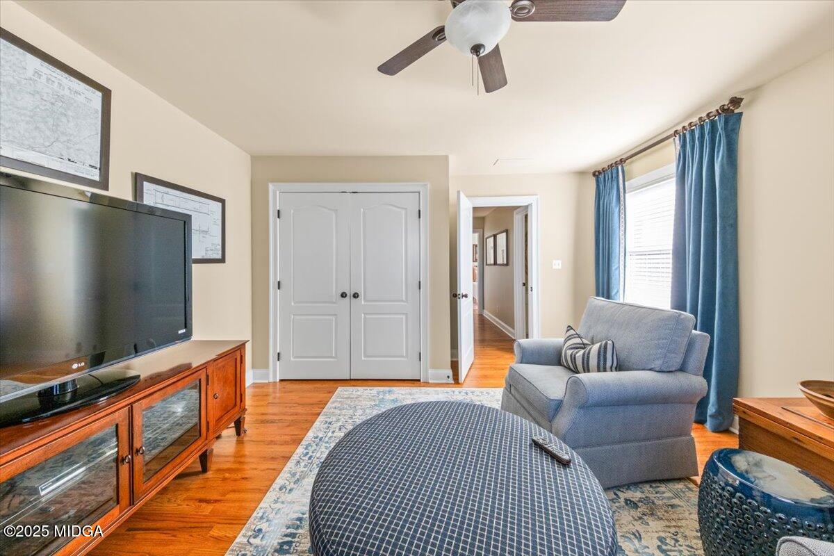 1060 East Magnolia Loop Madison, GA 30650 - Photo 29 of 41 a living room with furniture and a flat screen tv