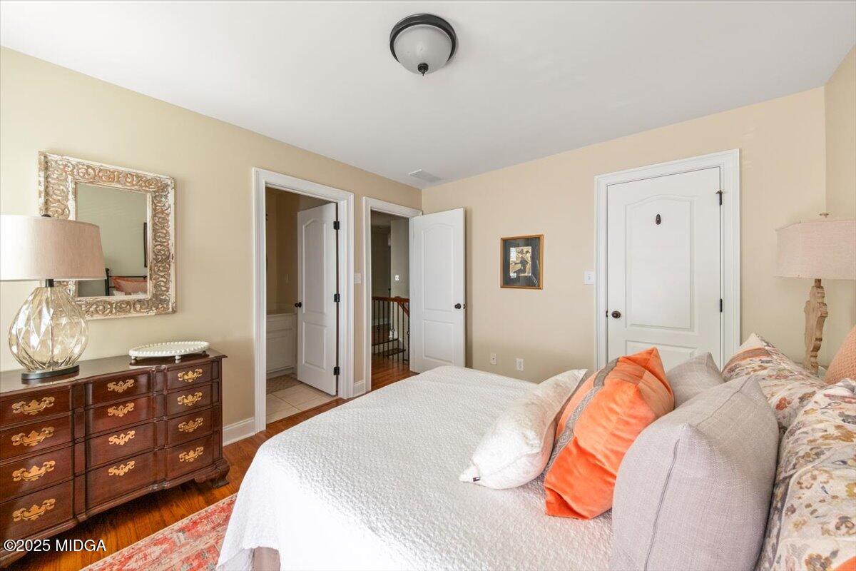 1060 East Magnolia Loop Madison, GA 30650 - Photo 32 of 41 a bedroom with a bed and a dresser