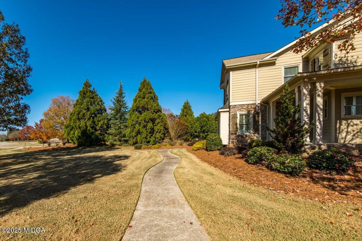 1060 East Magnolia Loop Madison, GA 30650 - Photo 36 of 41 a view of a house with a yard