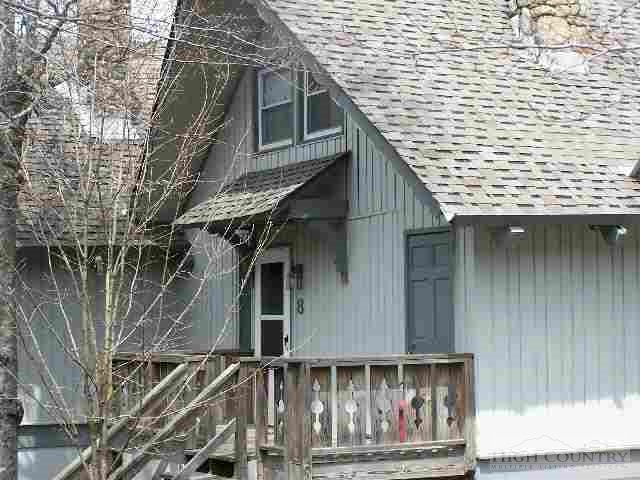 a front view of a house with garage