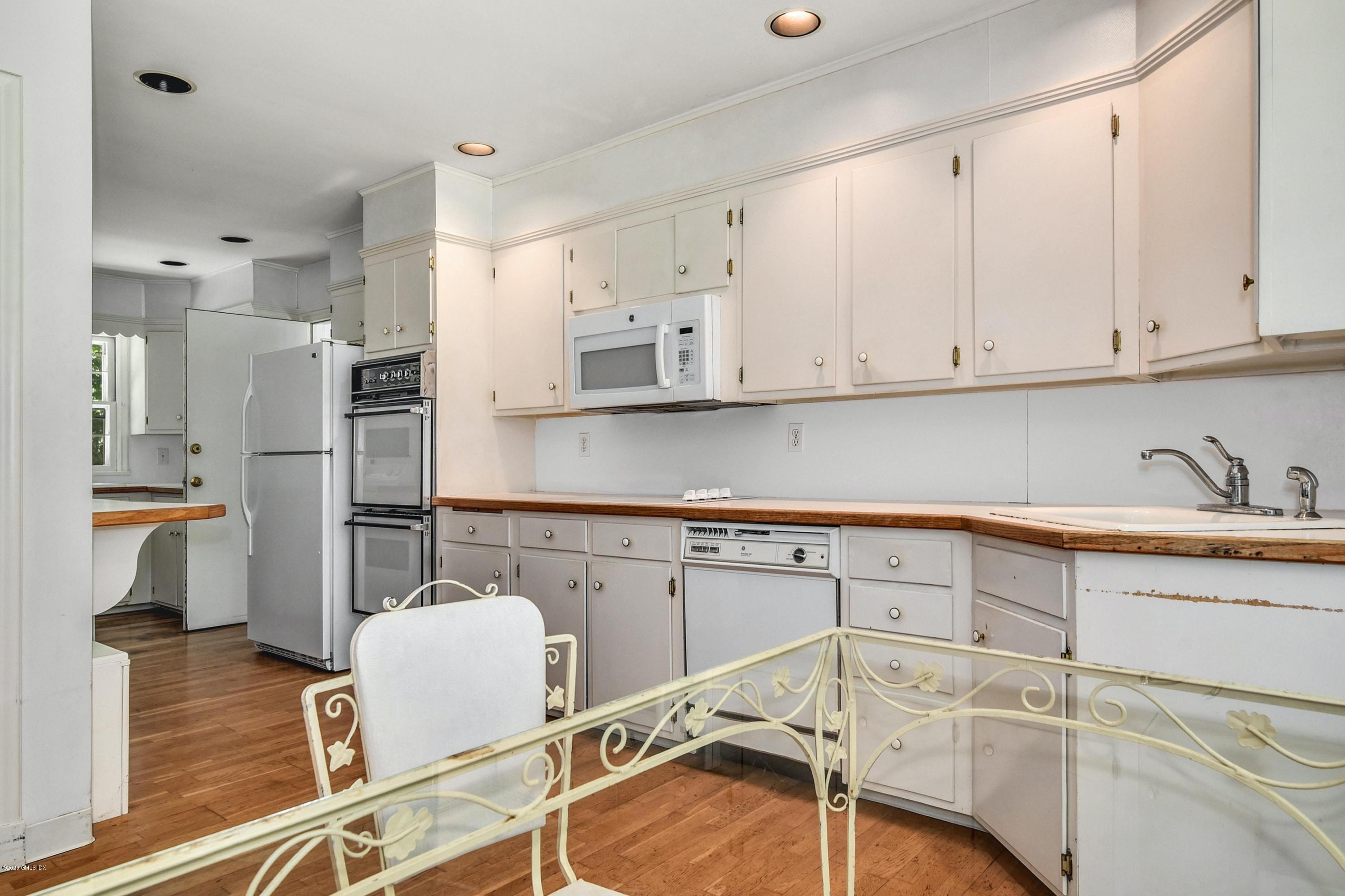 230 Stanwich Road Greenwich, CT 06830 - Photo 11 of 28 a kitchen with stainless steel appliances cabinets a sink and a stove