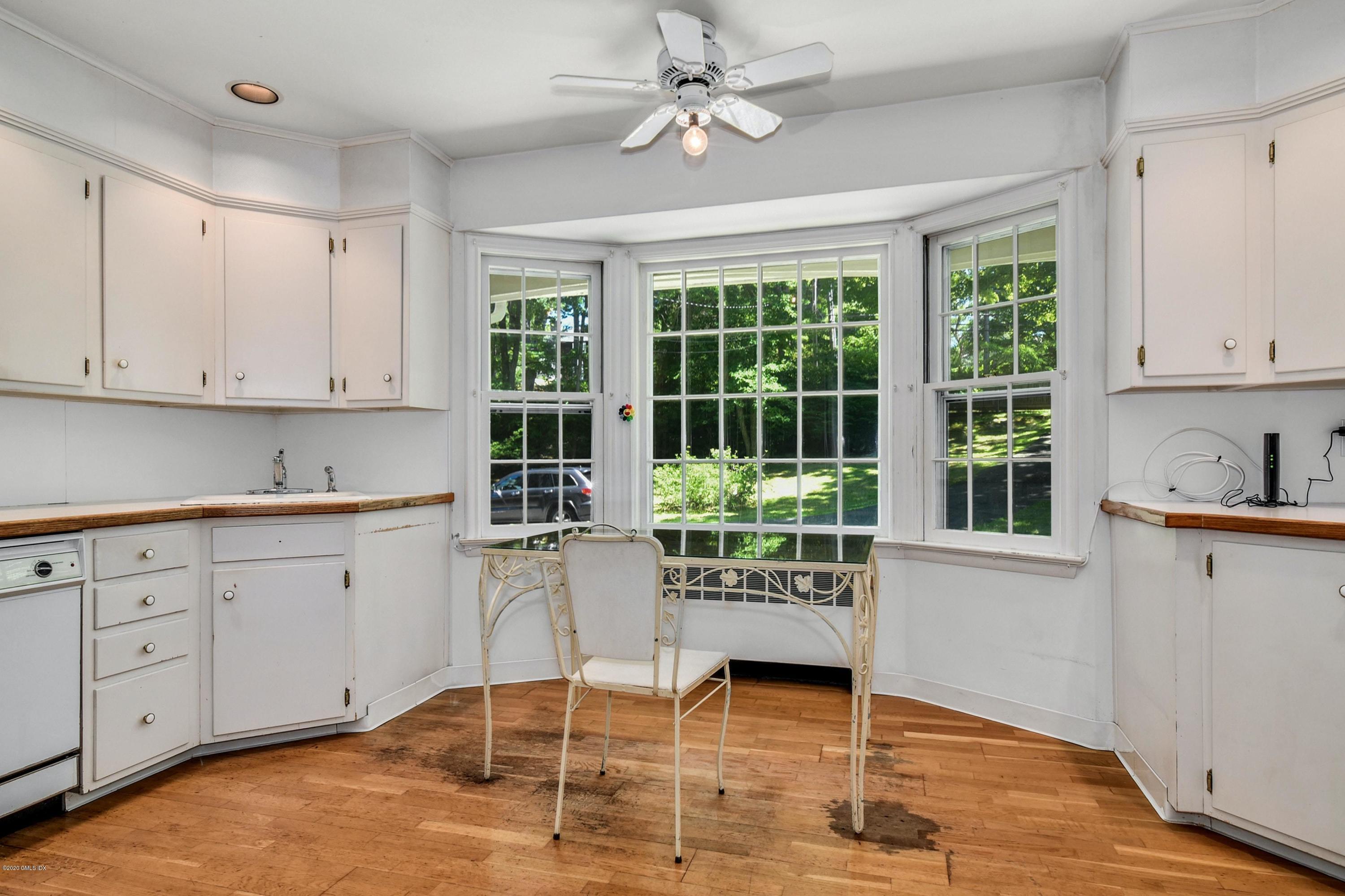 230 Stanwich Road Greenwich, CT 06830 - Photo 12 of 28 a kitchen with cabinets and window