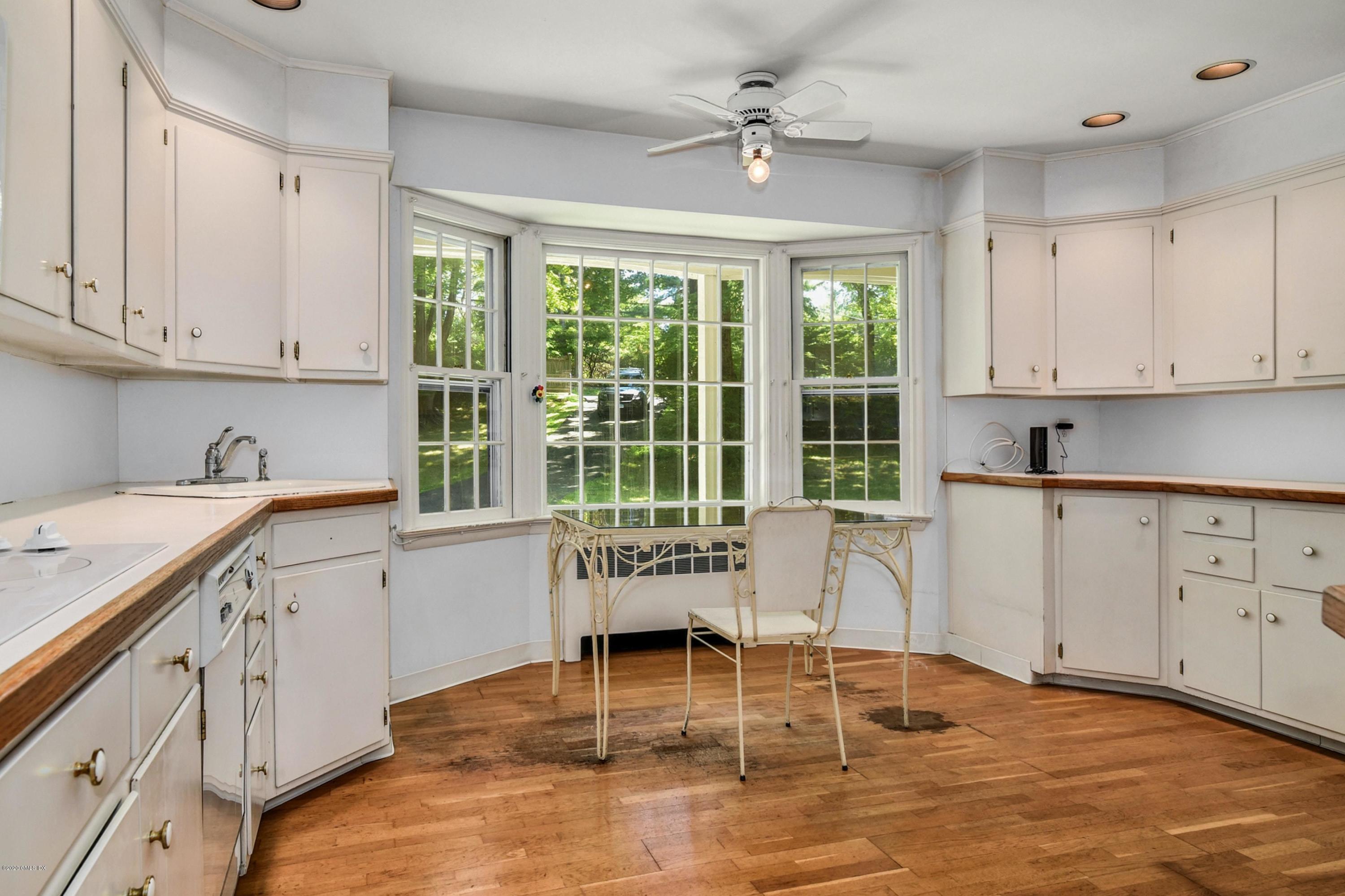 230 Stanwich Road Greenwich, CT 06830 - Photo 13 of 28 a living room with granite countertop furniture and a window