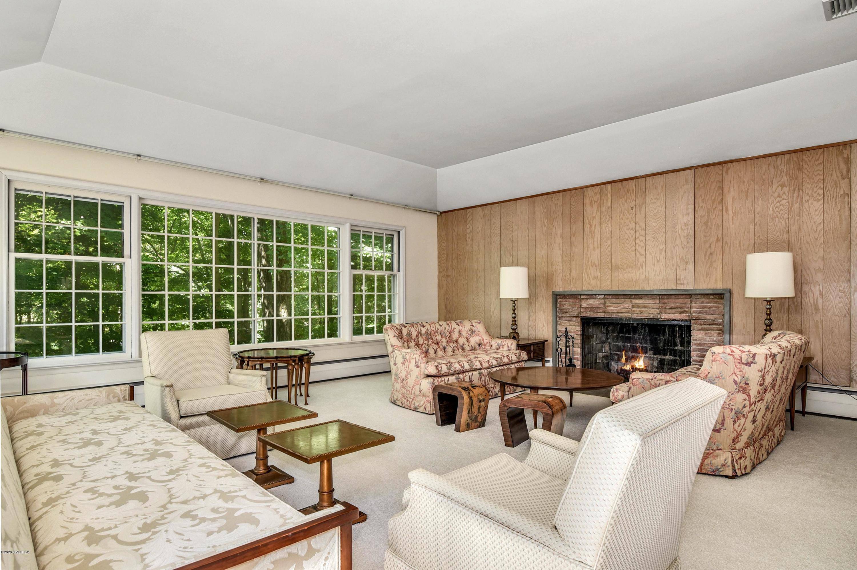 230 Stanwich Road Greenwich, CT 06830 - Photo 15 of 28 a living room with furniture large window and fireplace