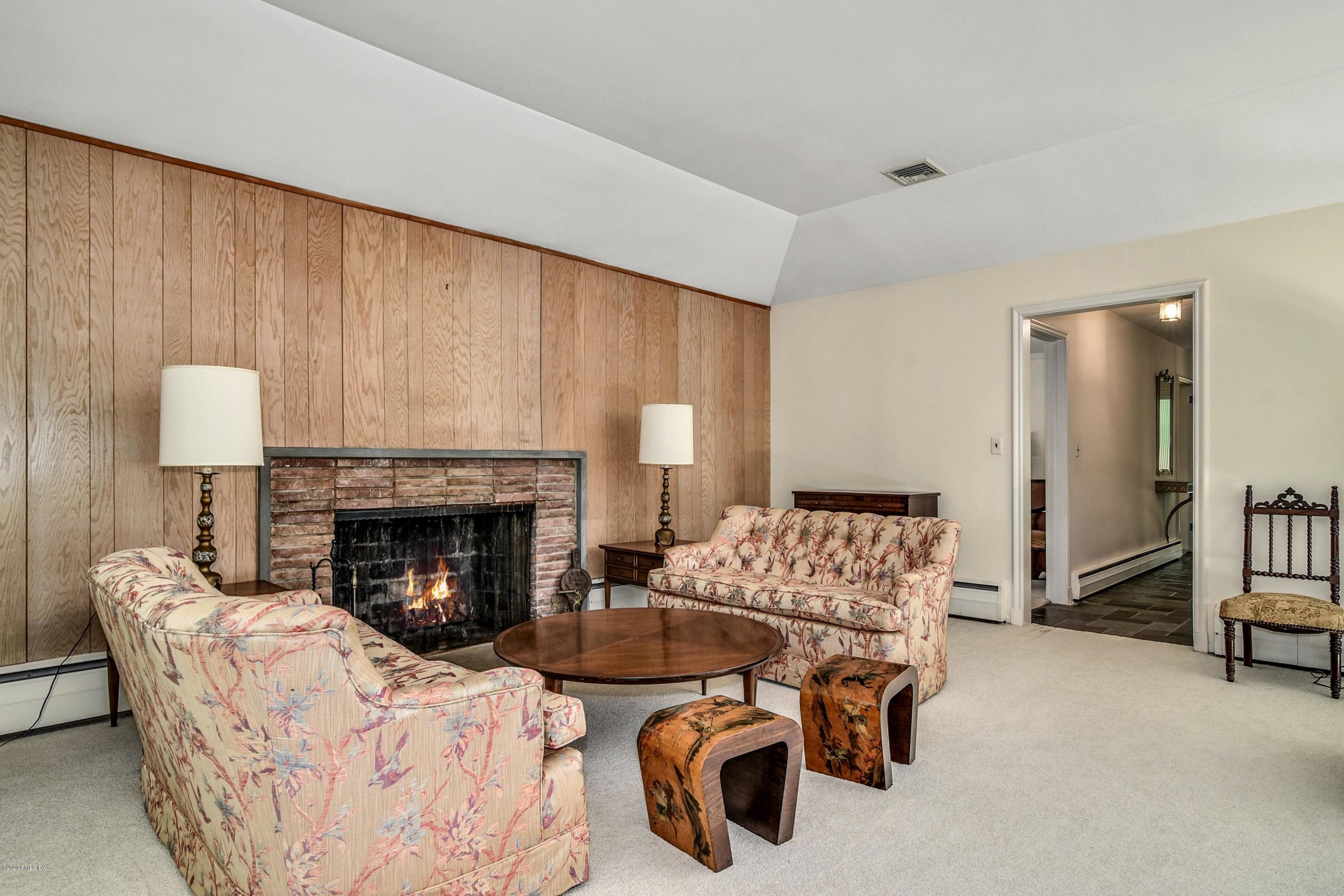 230 Stanwich Road Greenwich, CT 06830 - Photo 16 of 28 a living room with furniture and a fireplace