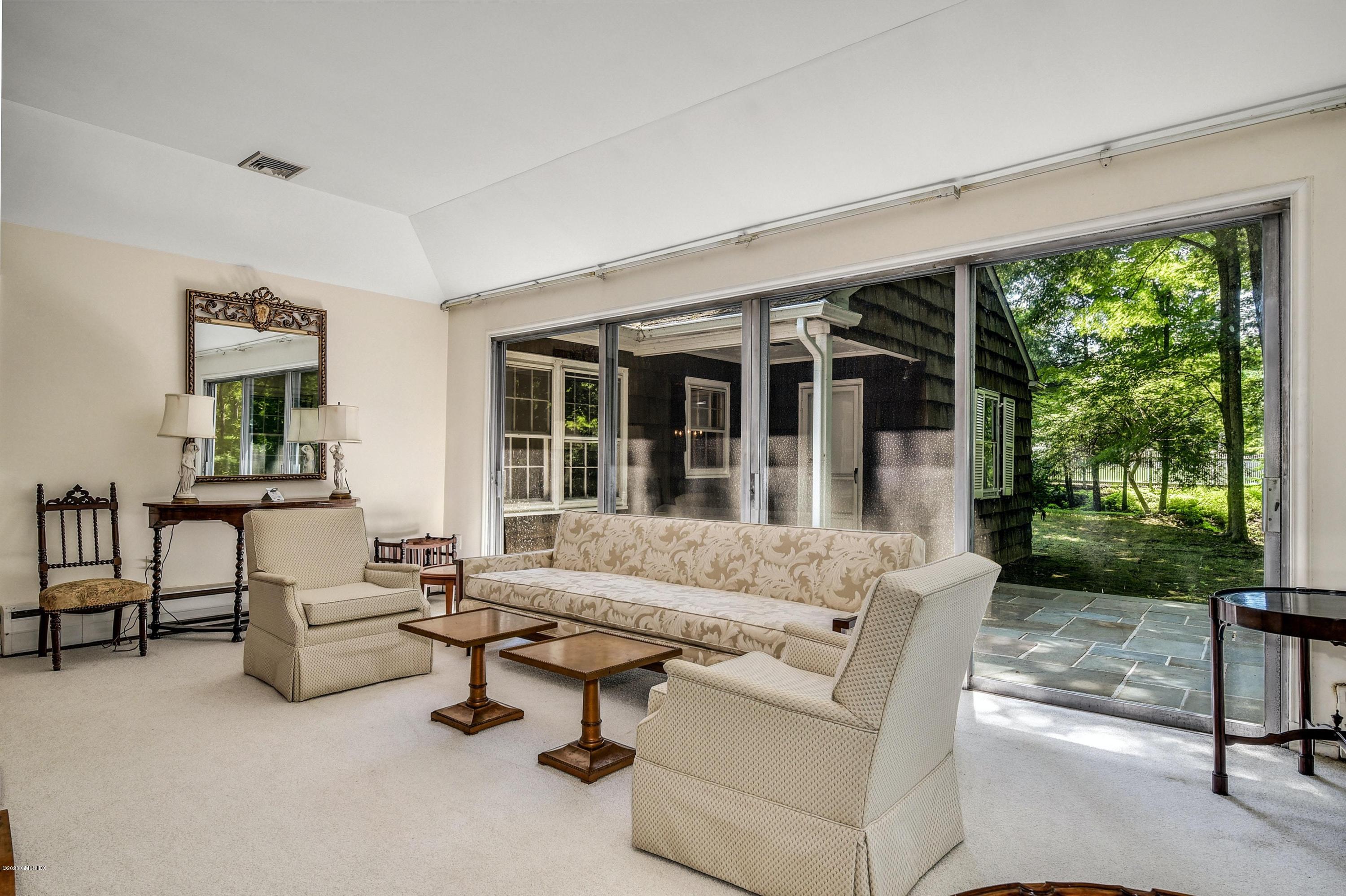 230 Stanwich Road Greenwich, CT 06830 - Photo 17 of 28 a living room with furniture and a large window
