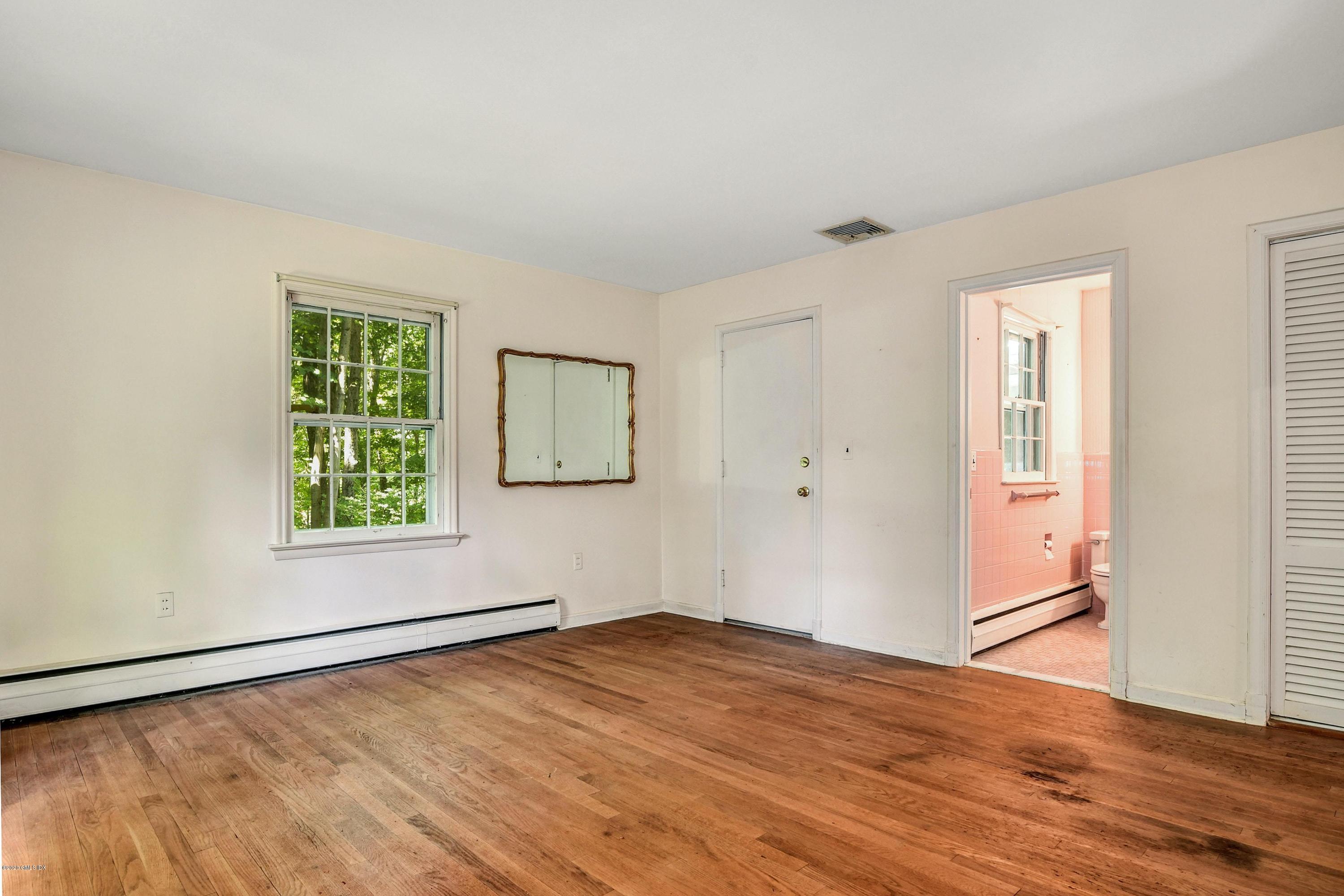 230 Stanwich Road Greenwich, CT 06830 - Photo 18 of 28 a view of empty room with wooden floor and fan