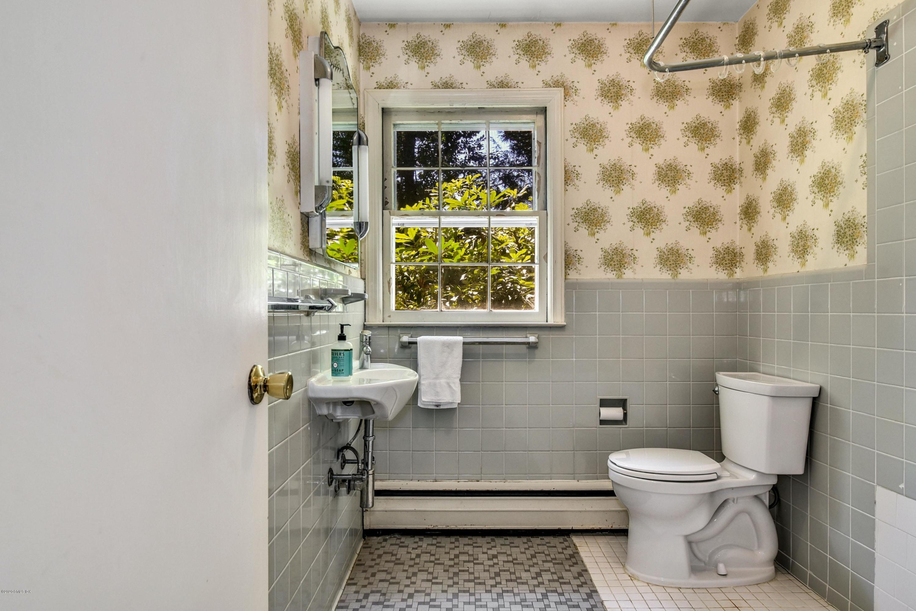 230 Stanwich Road Greenwich, CT 06830 - Photo 23 of 28 a bathroom with a toilet and a window