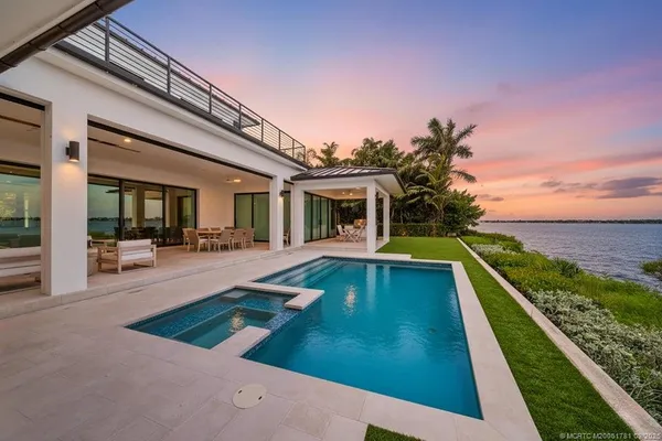 a view of a house with swimming pool