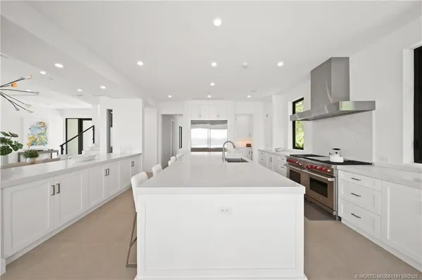 a kitchen with a table and chairs in it