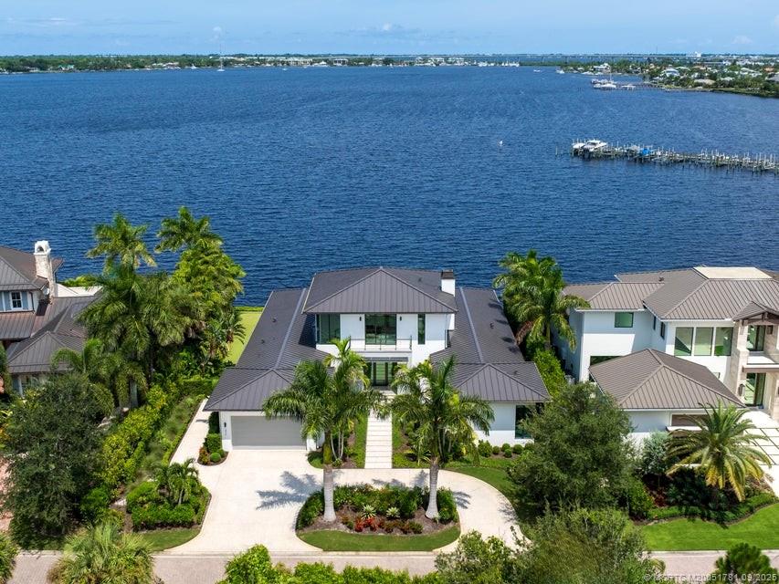 2834 Southwest Rivers End Way Palm City, FL 34990 - Photo 2 of 62 an aerial view of a house with outdoor space and lake view