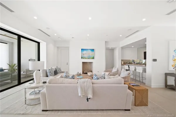 a living room with furniture and a table