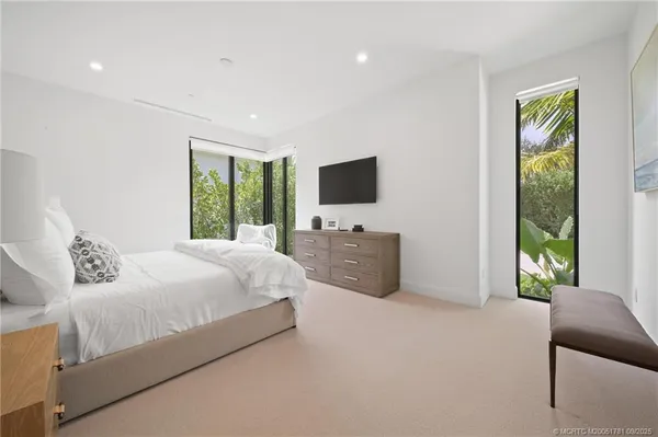 a bathroom with a double vanity sink toilet and shower
