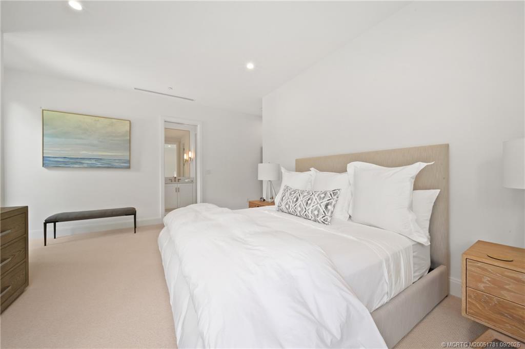 2834 Southwest Rivers End Way Palm City, FL 34990 - Photo 38 of 62 a large white bed in a white room
