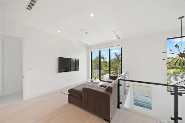 an aerial view of house with a swimming pool outdoor seating and yard