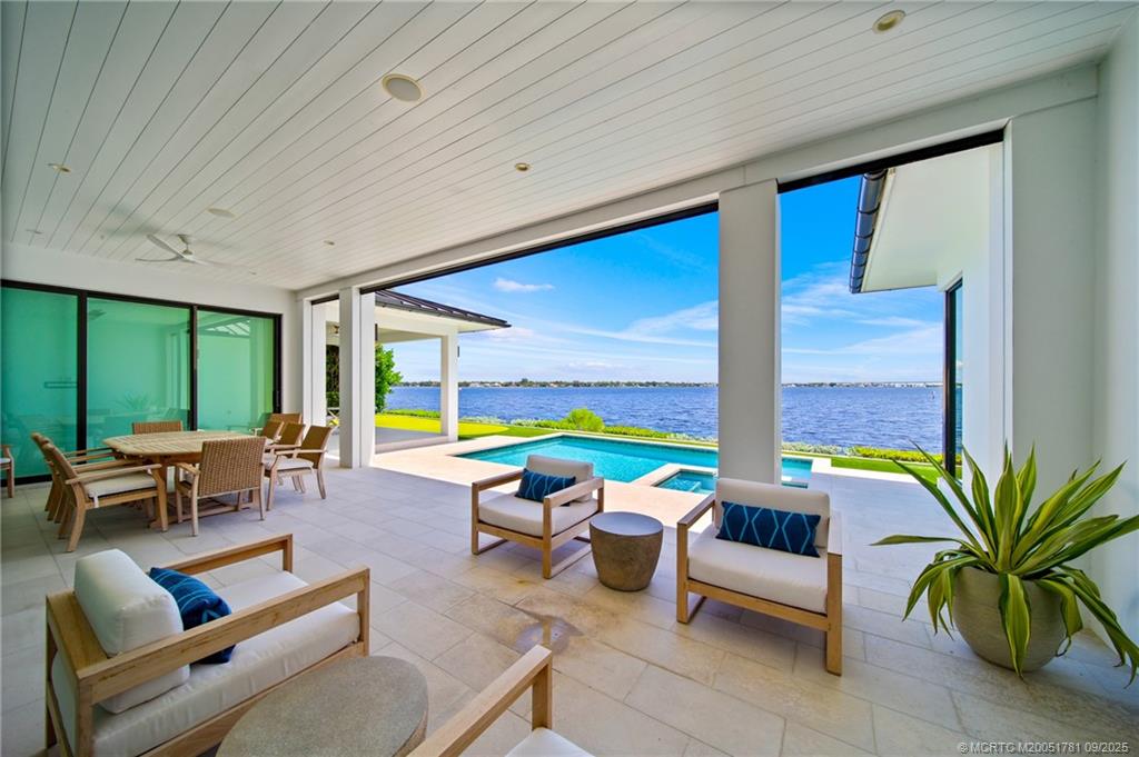 2834 Southwest Rivers End Way Palm City, FL 34990 - Photo 7 of 62 a building outdoor space with patio furniture