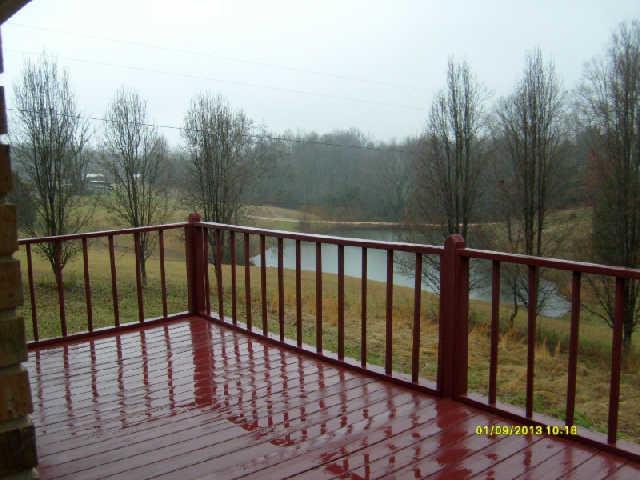 226 Busby Road Loretto, TN 38469 - Photo 9 of 16 a view of wooden balcony with yard