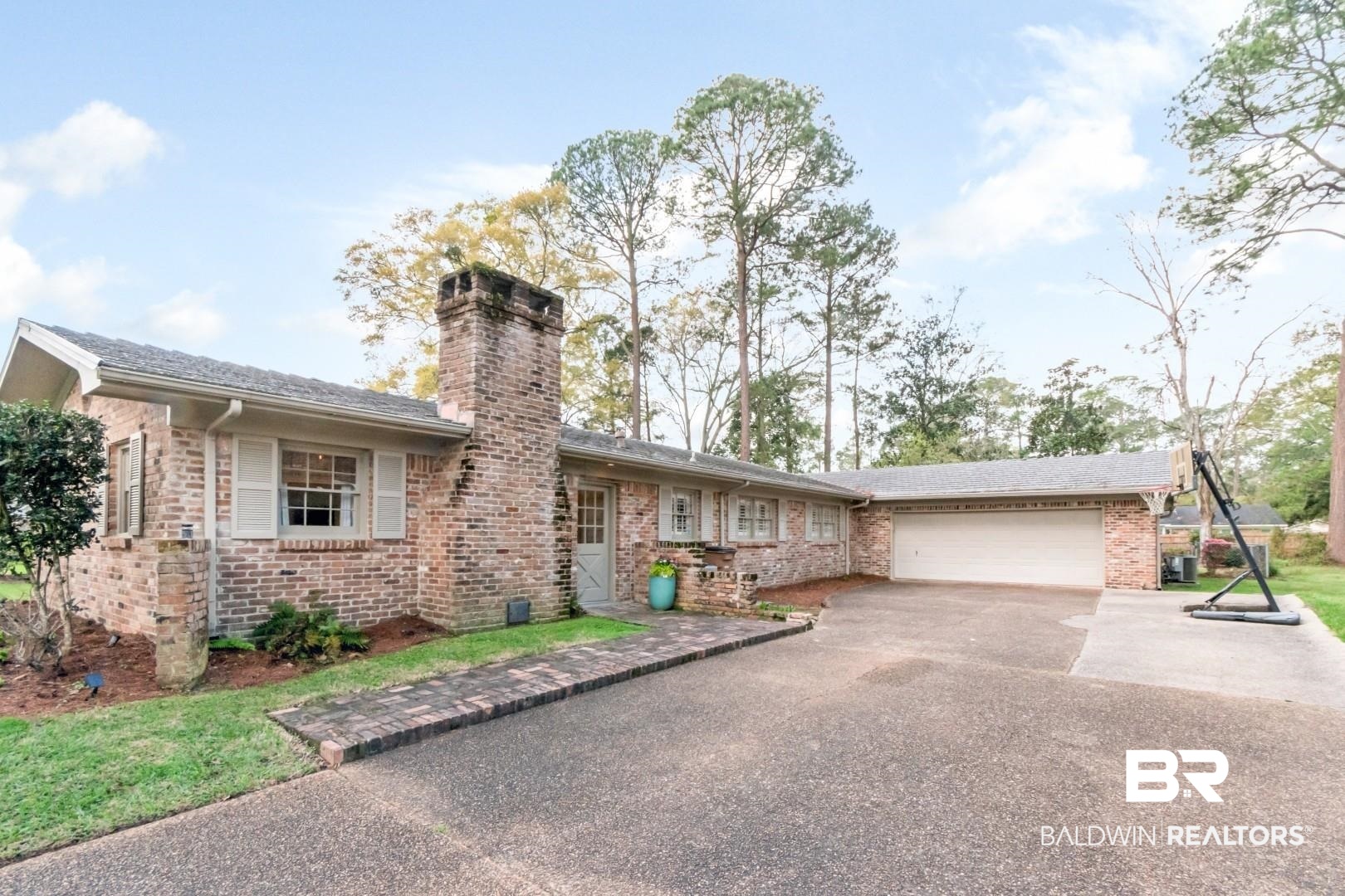 154 Fenwick Road Mobile, AL 36608 - Photo 47 of 48 Ranch-style home with asphalt driveway, brick siding, a garage, and a chimney