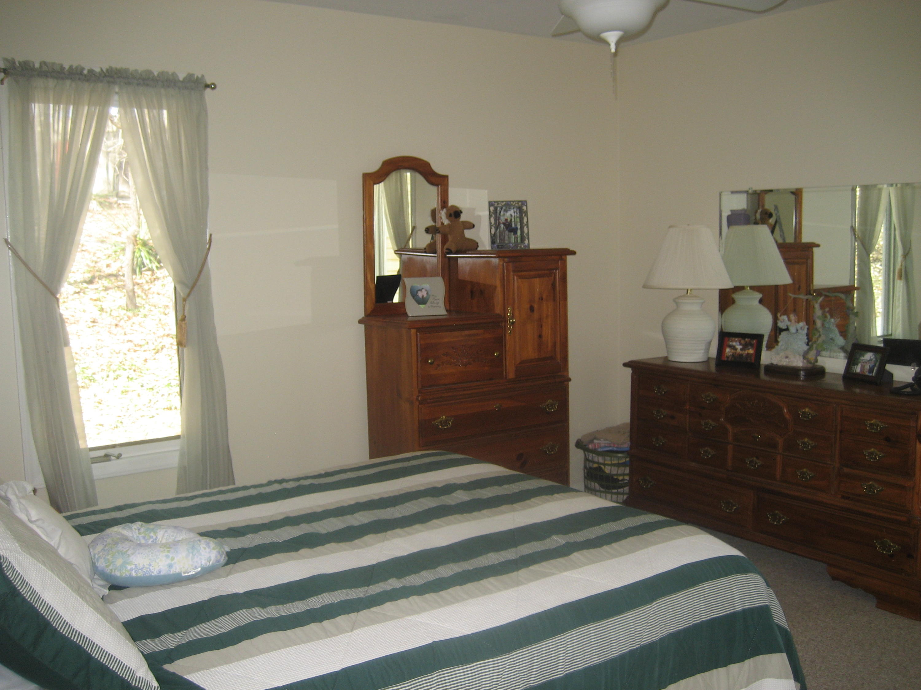 575 Highland Lake Road Union Hall, VA 24176 - Photo 15 of 18 a bedroom with a bed and wooden floor