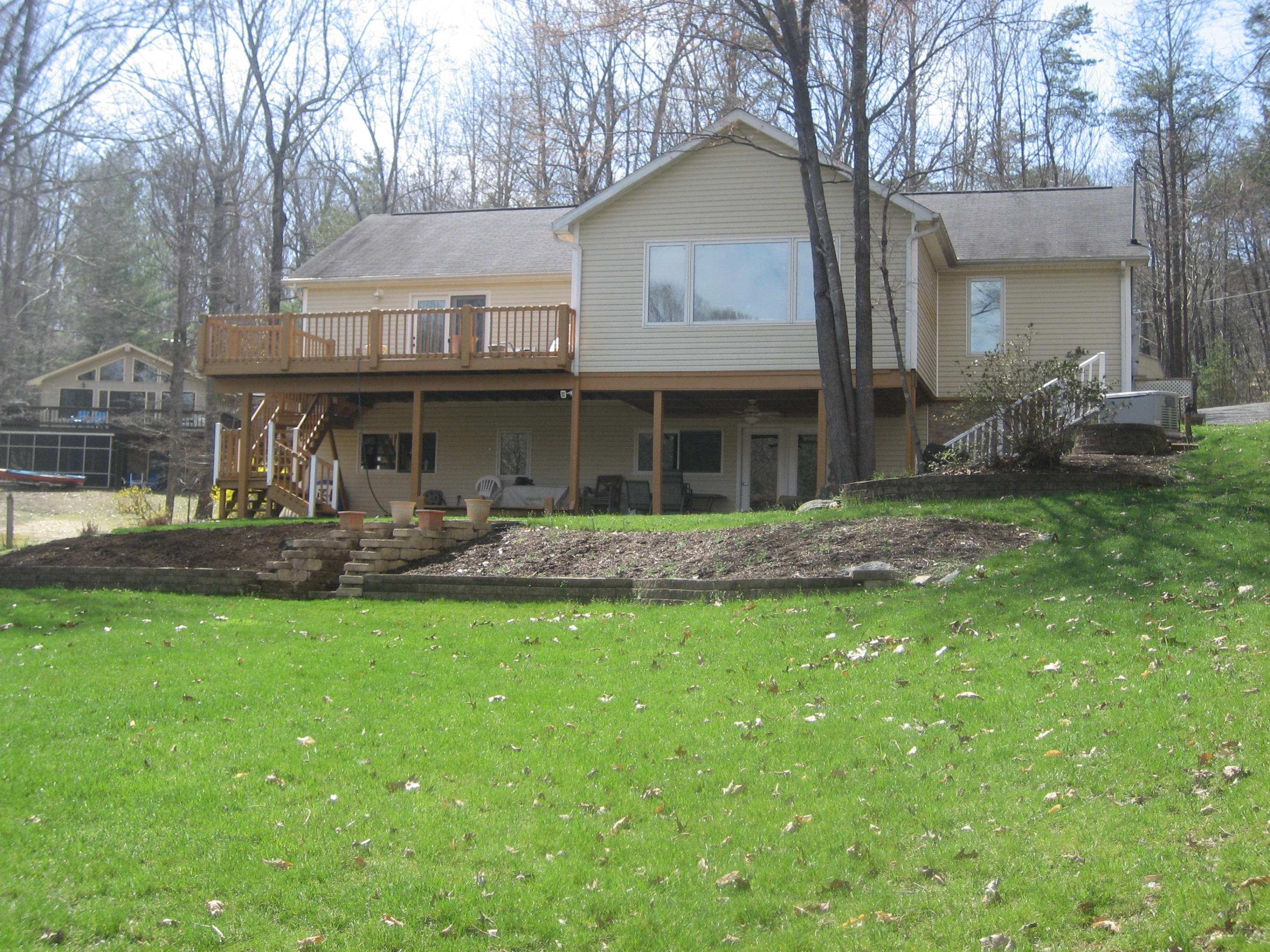 575 Highland Lake Road Union Hall, VA 24176 - Photo 5 of 18 a front view of a house with a garden
