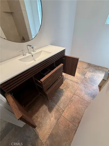 a bathroom with a toilet and a window