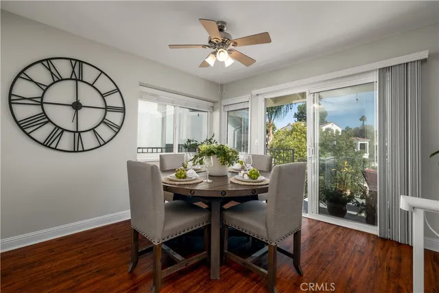 a kitchen with white cabinets and appliances