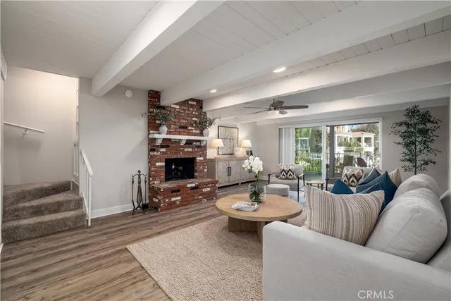 a view of a patio with table and chairs potted plants with wooden fence