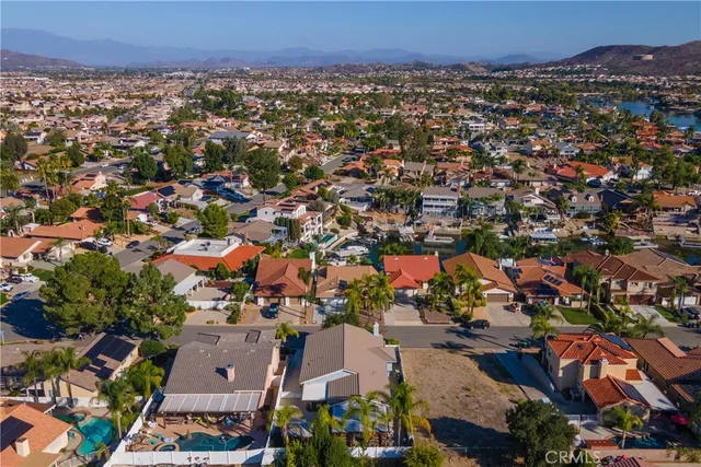 an aerial view of a house with a garden and swimming pool