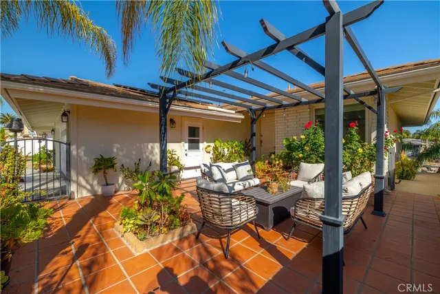 a outdoor living space with furniture and a potted plant