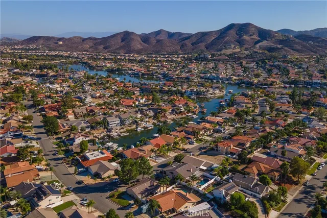 an aerial view of residential house with outdoor space and lake view