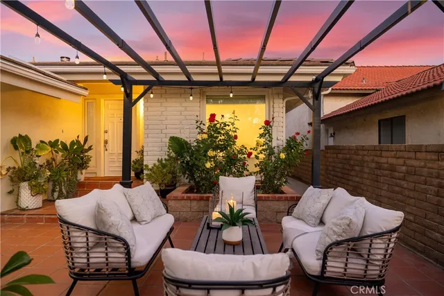 a potted plant sitting in front of a door