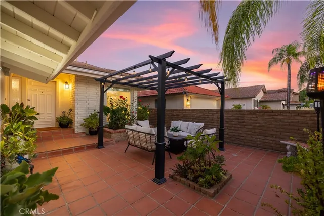 a living room with furniture fireplace and window