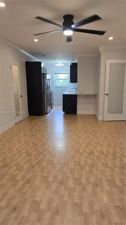 a view of a livingroom with a kitchen