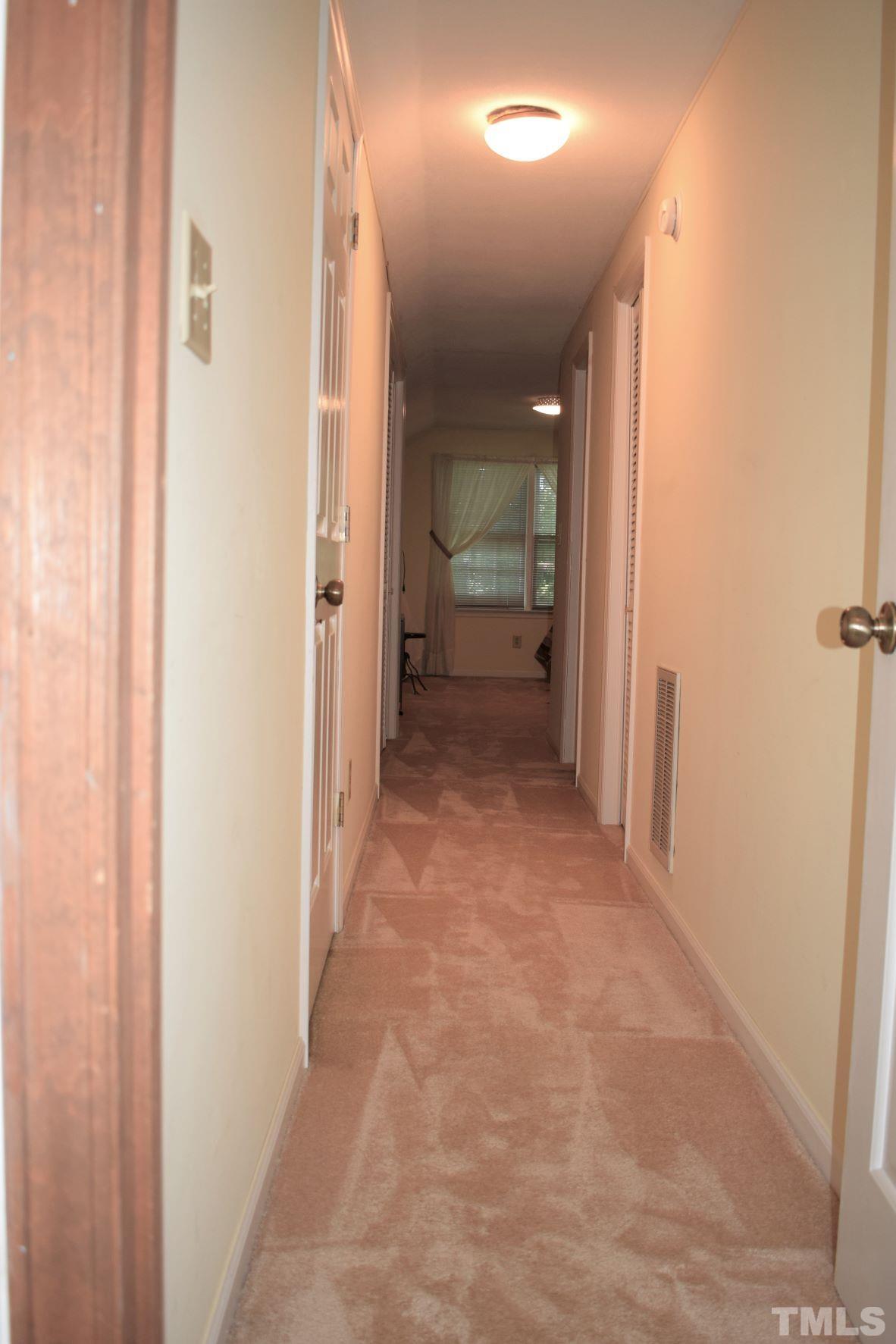 2204 Rangecrest Road Raleigh, NC 27612 - Photo 21 of 28 Hallway to Guest Suite/Teen Suite or terrific Sewing Room/Craft Room.