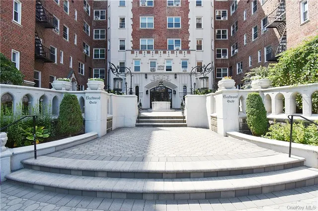 a front view of a building with garden