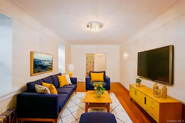 a living room with furniture and a flat screen tv