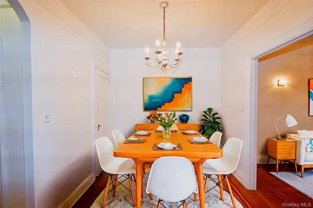 a dining room with furniture and wooden floor
